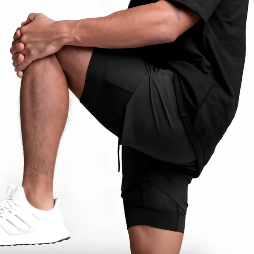 Northrun - 2-i-1 treningsshorts med sprettfri mobil­lomme.
